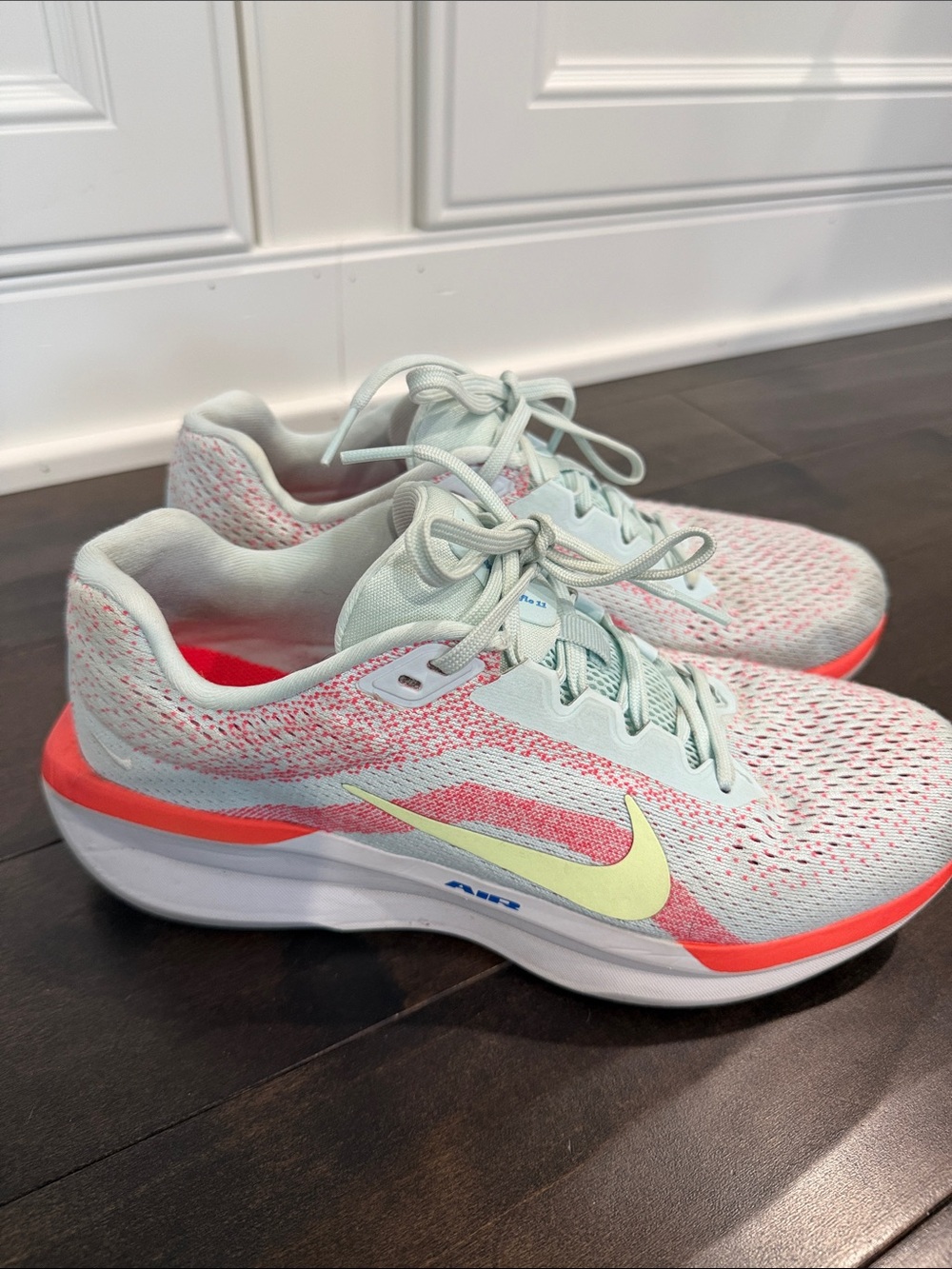 Nike Winflow 11 Women’s Athletic Shoes in light blue with Coral and Pale Yellow